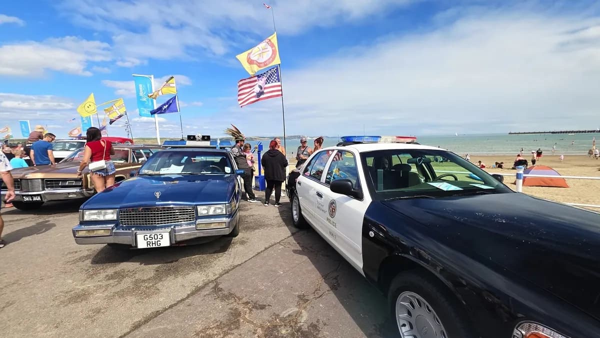 Two police cars at the beach