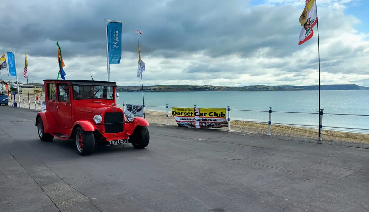 Red hot rod arriving at Weymouth beach